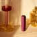 Ploom AURA Dark Orchid device standing on a table.